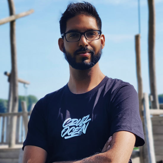 Man posing by water